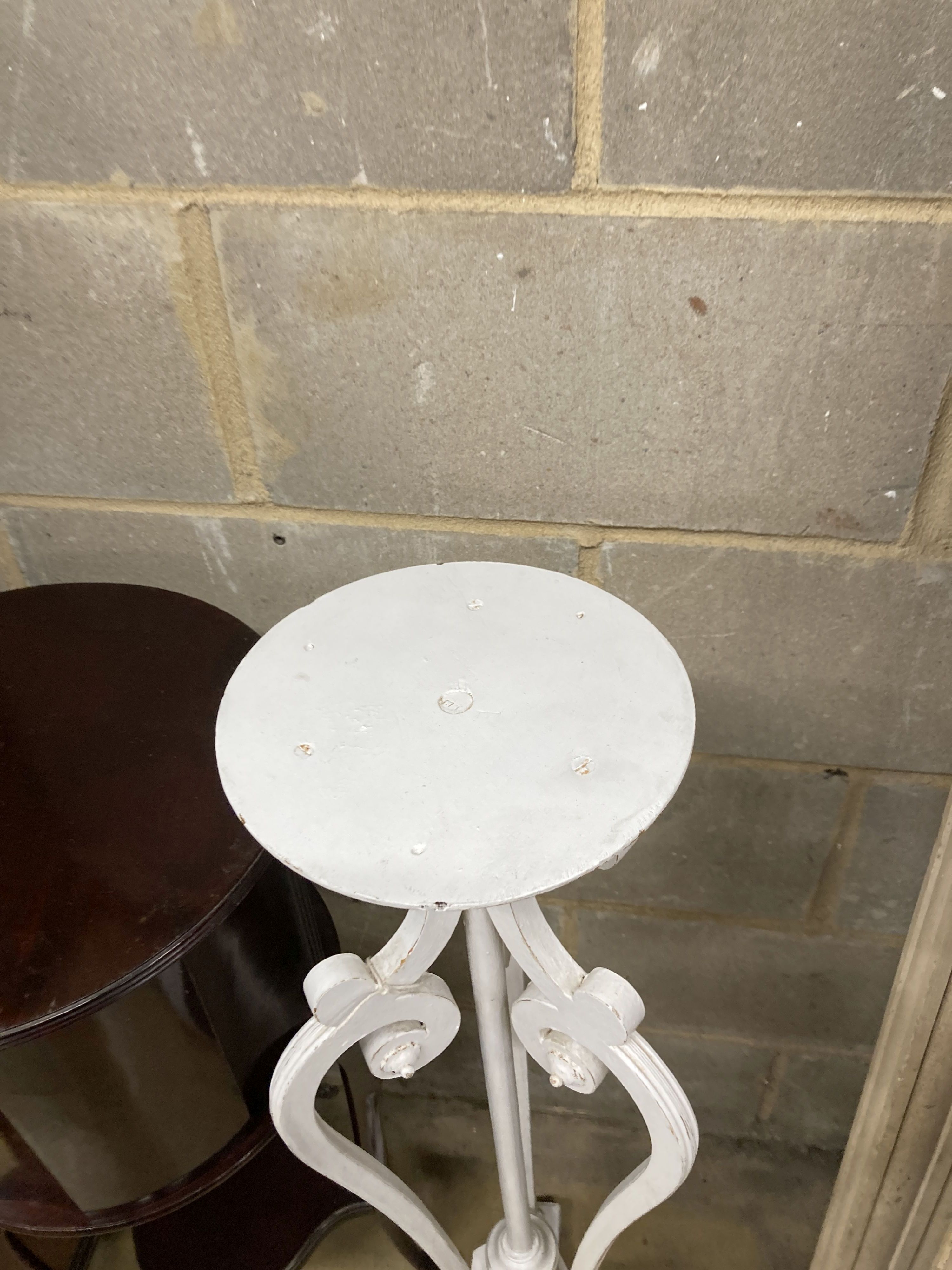 An Edwardian mahogany circular jardiniere stand, 34cm diameter, 89cm high together with a painted plant stand